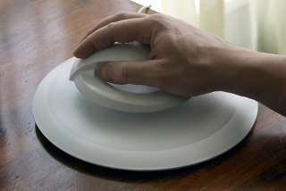 Illustration for article titled Is this hovering computer mouse real or fake?